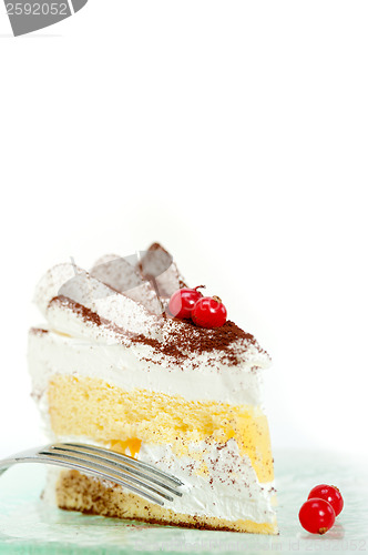 Image of whipped cream and ribes dessert cake slice