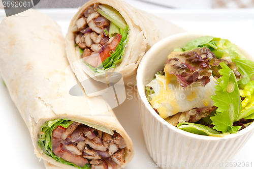 Image of kafta shawarma chicken pita wrap roll sandwich