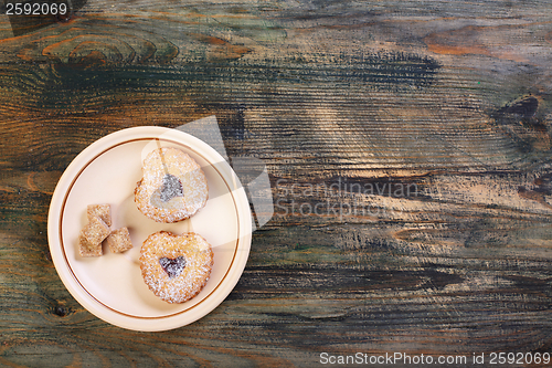 Image of Saucer with cookies and sugar.
