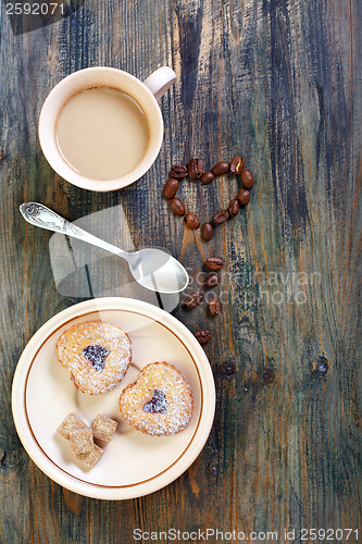 Image of Coffee, cookies and heart of coffee beans. 
