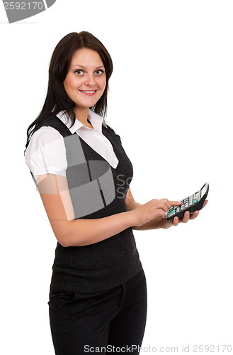 Image of Beautiful smiling girl with a calculator in hand