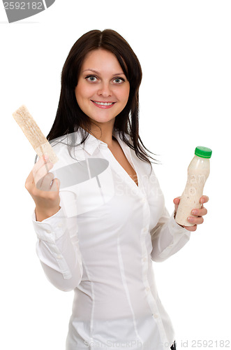 Image of Beautiful girl with yogurt and crackers 