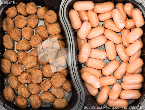 Image of sausages and burgers close up