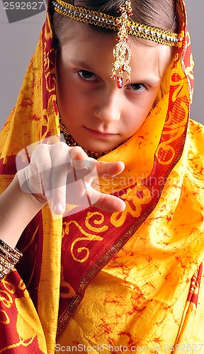 Image of little girl in traditional Indian clothing and jeweleries