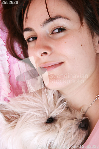 Image of Dog sleeping on bed 