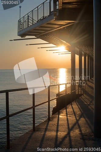 Image of Sunset pier along coast