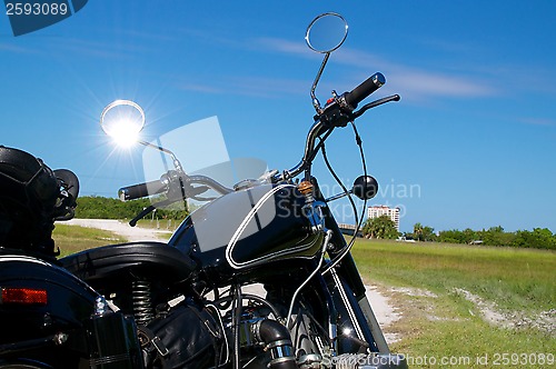 Image of vintage motorcycle on dirt road