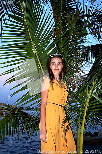 Image of woman on a background of palms