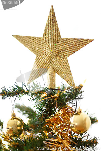 Image of Decorated christmas tree with yellow and green balls 