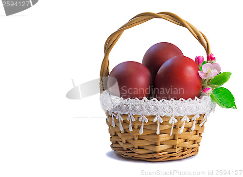 Image of Red Easter eggs in a basket on a white background.