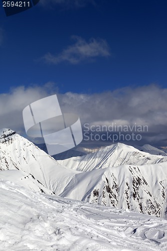 Image of Ski slope and beautiful snowy mountains