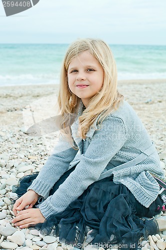 Image of pretty girl at the autumn beach 