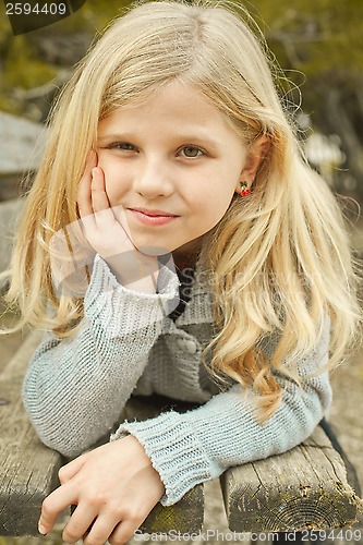 Image of pretty girl on a bench 