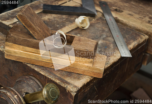 Image of Old wooden vise and tool in a workshop