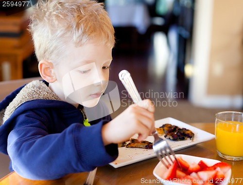 Image of child eating breakfast