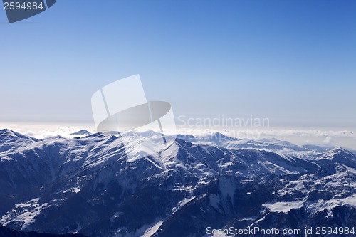 Image of Snowy mountains in haze at morning