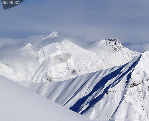 Image of Ski slope and snowy mountains