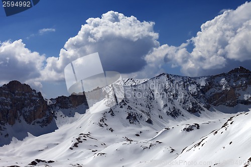 Image of Snowy mountains and blue sky with cloud in sun day