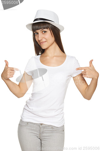 Image of Smiling woman pointing at blank white t-shirt