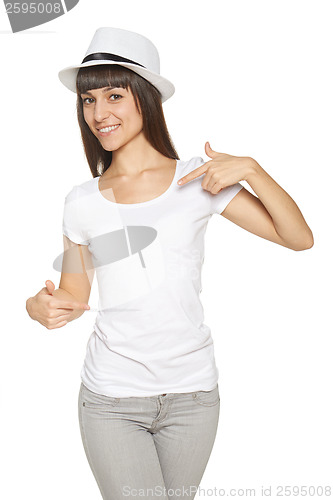 Image of Smiling woman pointing at blank white t-shirt