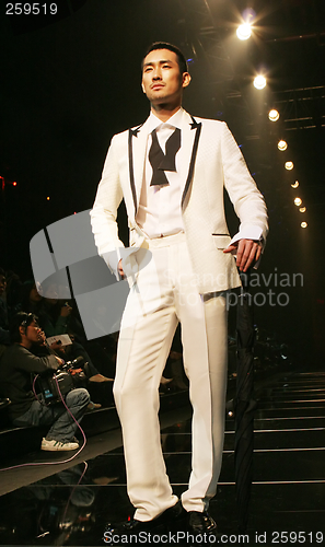 Image of Asian male model on the catwalk during a fashion show - EDITORIA