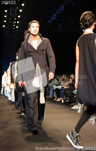 Image of Asian male model on the catwalk during a fashion show - EDITORIA