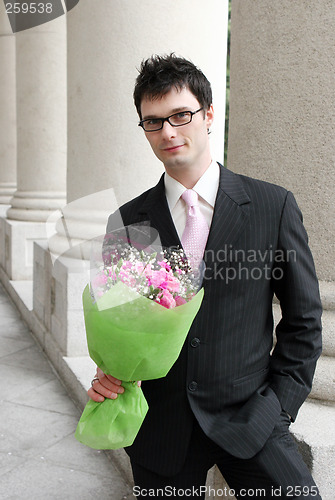 Image of Man with a bunch of flowers.