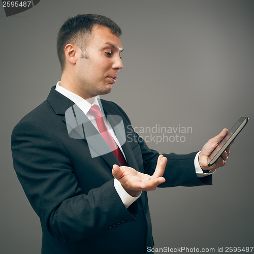 Image of business man with tablet pc