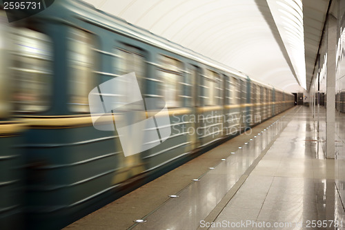 Image of train moving at subway station 