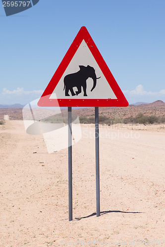 Image of Caution: Elephants! Road sign standing beside road