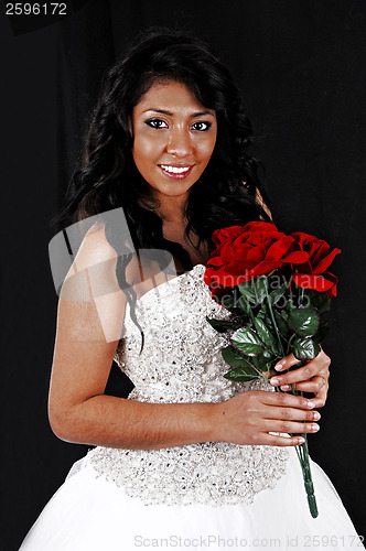 Image of Bride with red roses.