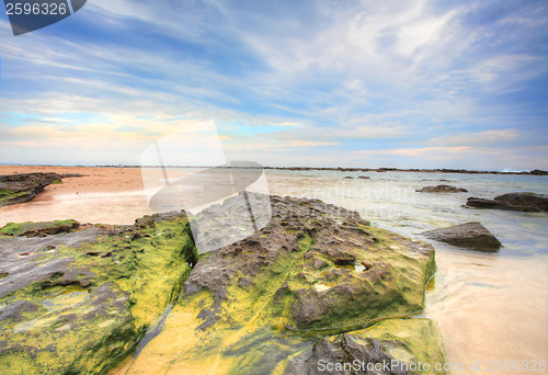 Image of Wispy clouds and rocky tidal flows