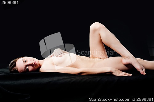 Image of sensual nude woman on black background