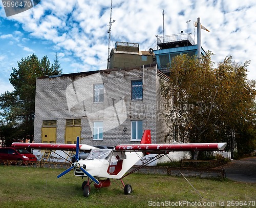 Image of Small airplane in little airport