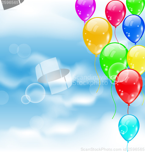 Image of Flying colourful balloons in blue sky