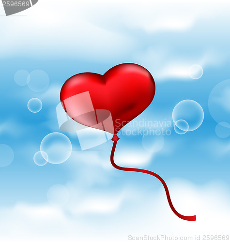 Image of Balloon in the shape of heart in blue sky