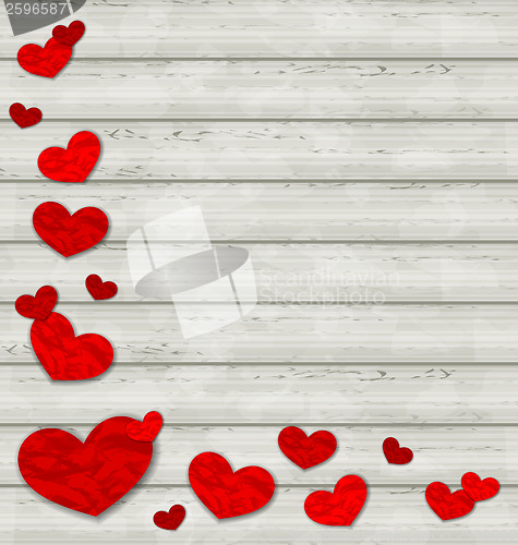 Image of Set crumpled paper hearts on wooden background