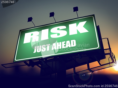 Image of Risk Just Ahead on Green Billboard.