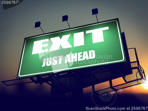 Image of Exit Just Ahead on Green Billboard.