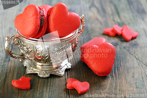 Image of Marzipan hearts and red macaroons. 