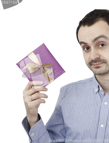 Image of Young man holding a present