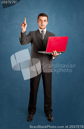 Image of Business Man Shows Something With Finger