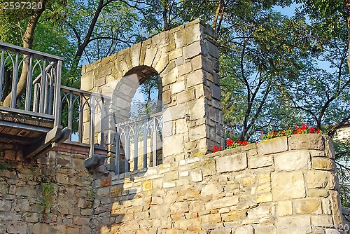 Image of Medieval stone wall with flowers