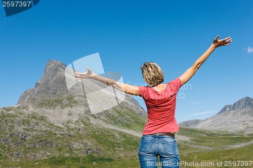 Image of Happy woman enjoying freedom