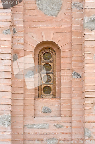 Image of Old window on a brick wall.