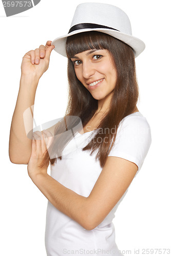 Image of Stylish casual young woman posing with a hat