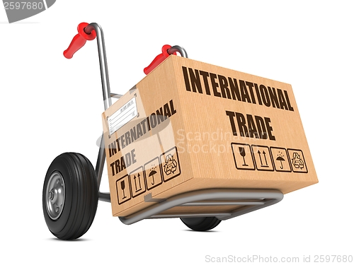 Image of International Trade - Cardboard Box on Hand Truck.