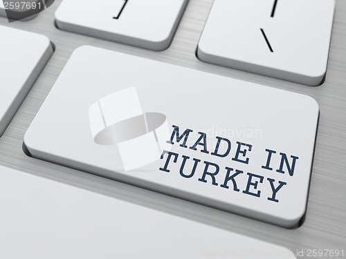 Image of Made in Turkey on Button of White Keyboard.