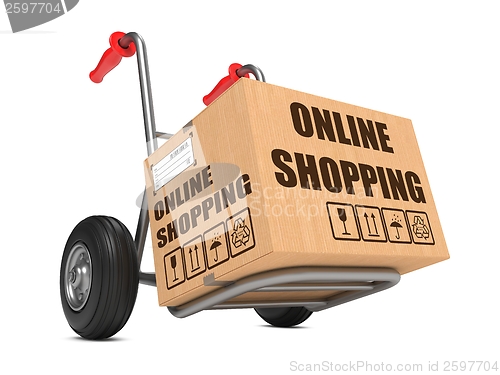 Image of Online Shopping - Cardboard Box on Hand Truck.