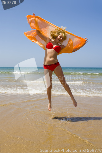 Image of Girl runs on beach